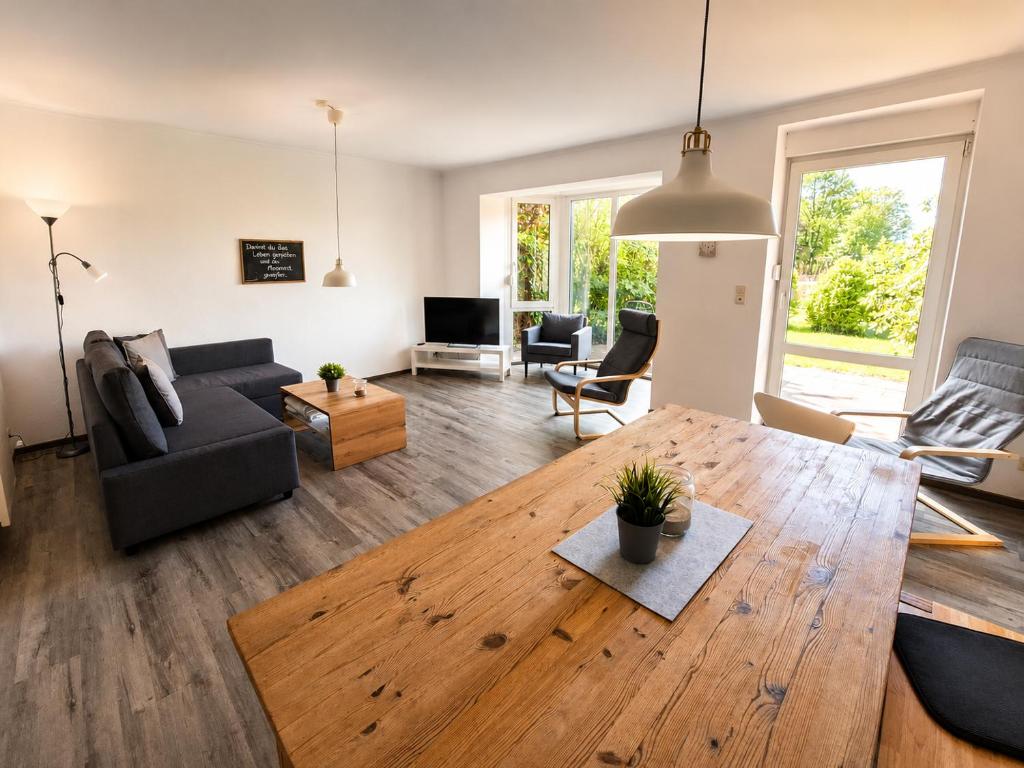 a living room with a couch and a wooden table at Rauszeit-Balje in Balje