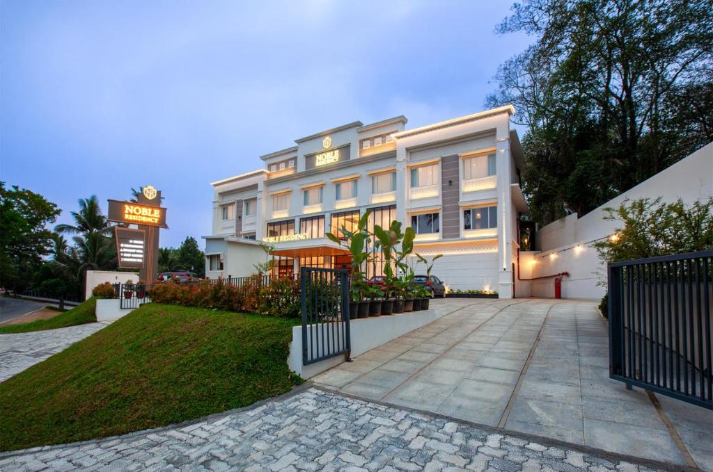 a rendering of the exterior of a hotel at Hotel Noble Residency in Kizhillam