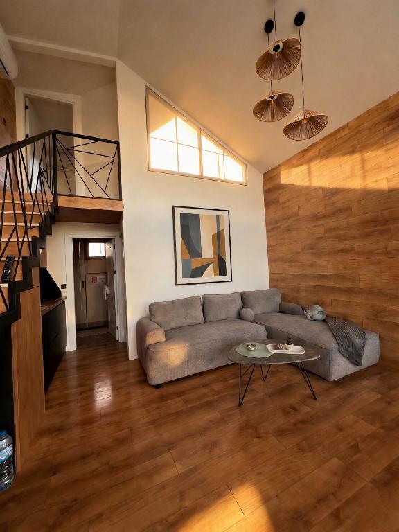 a living room with a couch and a table at Buna riverfront in Ulcinj