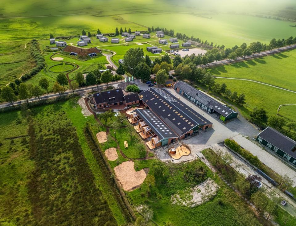 an aerial view of a estate with a train station at Buiteninn in Rijssen