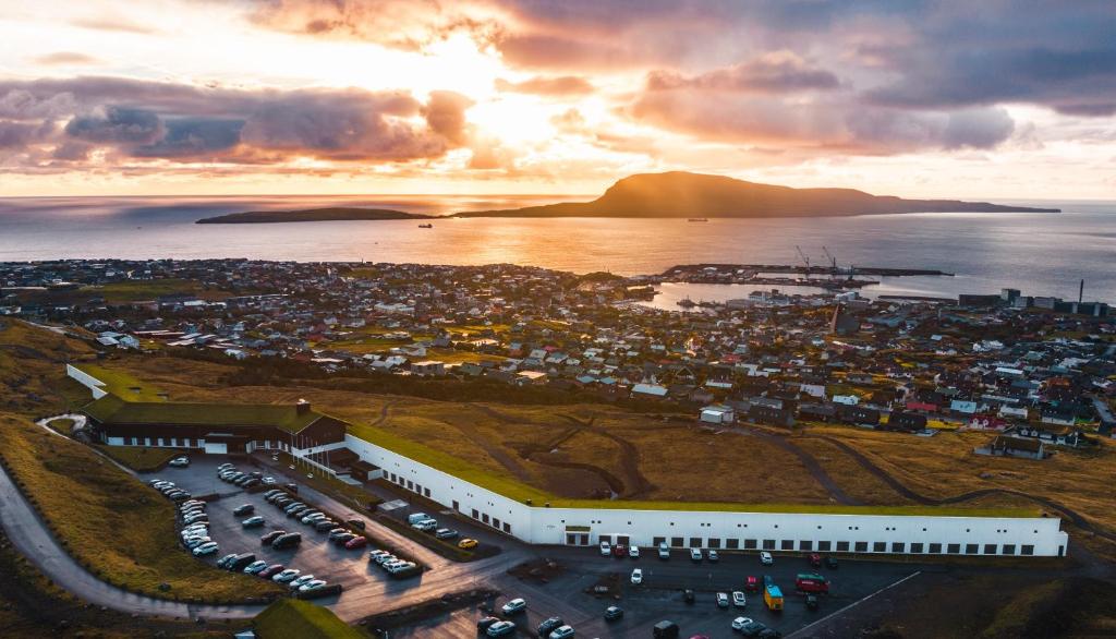 an aerial view of a city with a parking lot at Hotel Føroyar in Tórshavn