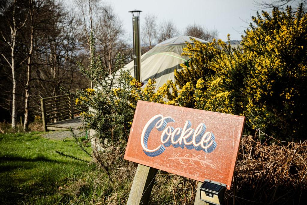 a sign that says coleittle sitting in a field at Kelburn Yurts - Cockle in Fairlie