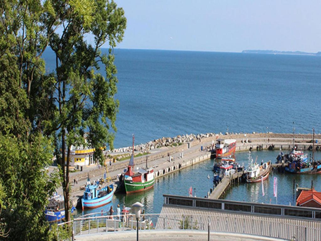 a group of boats are docked at a beach at Villa Amelie FeWo Seemoewe in Sassnitz