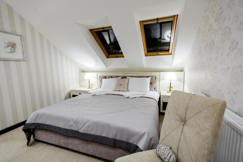 Postel nebo postele na pokoji v ubytování Galant Hotel