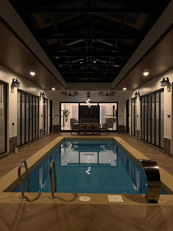 a large swimming pool in a house at Elite Cozy Home 5BR5B, BBQ, Karaoke, Netflix, Near MITC in Ayer Keroh