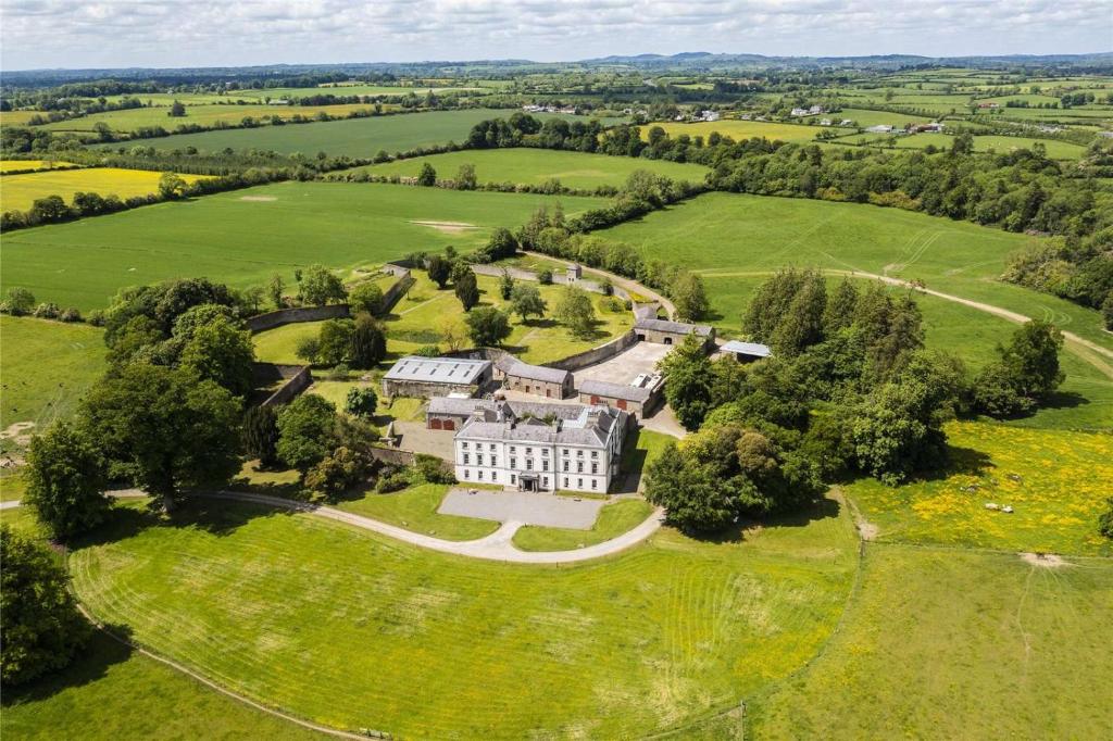 an aerial view of a mansion in a field at Rockfield House in Kells