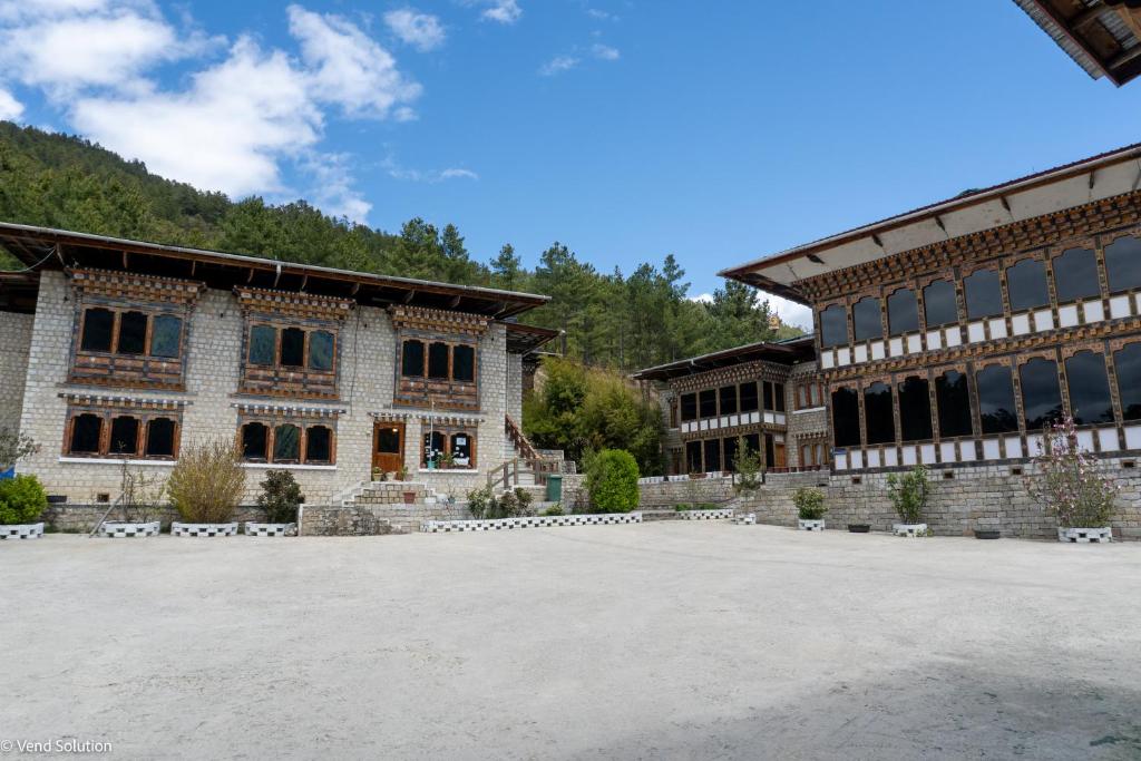 a large building with a lot of windows at Valley Resort in Jakar