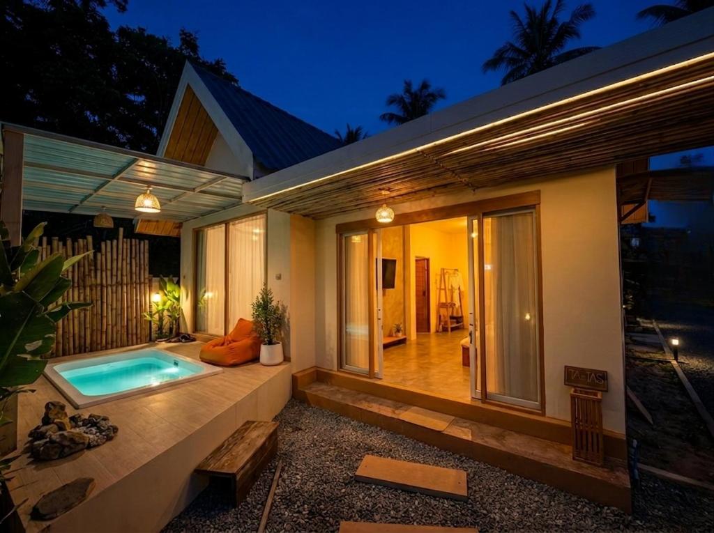 a house with a swimming pool in the backyard at Thara Pearl Villa in Ko Phangan