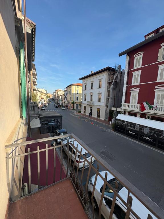 a view of a city street from a balcony at Dimora Corso Roma in Montecatini Terme