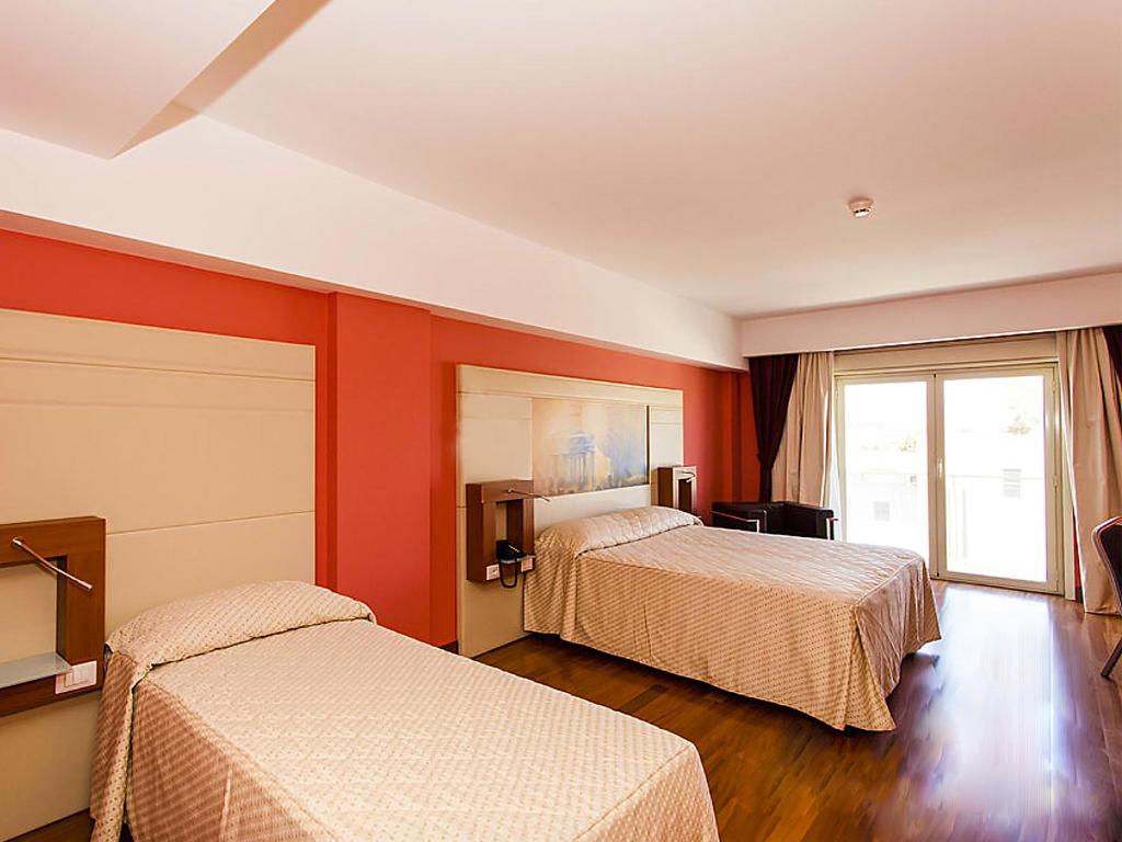 Postel nebo postele na pokoji v ubytování Catania International Airport Hotel