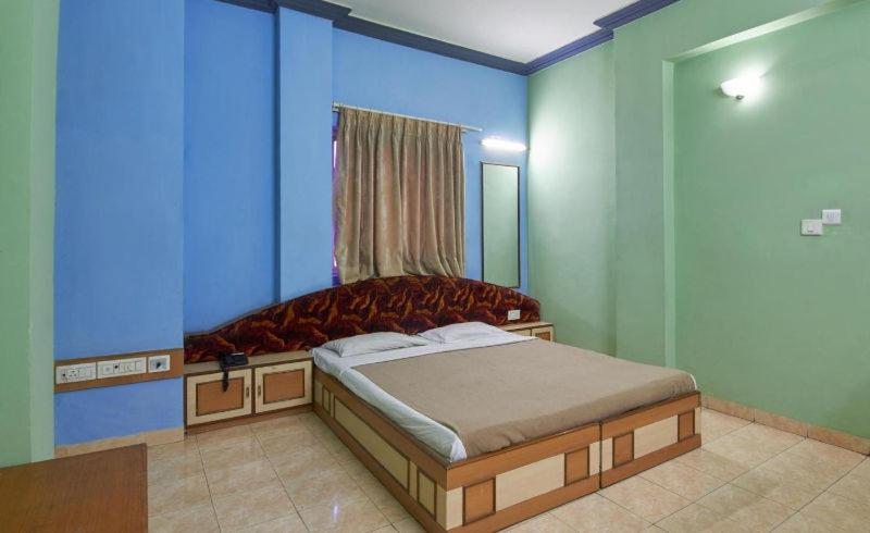 Postel nebo postele na pokoji v ubytování Hotel Damjis