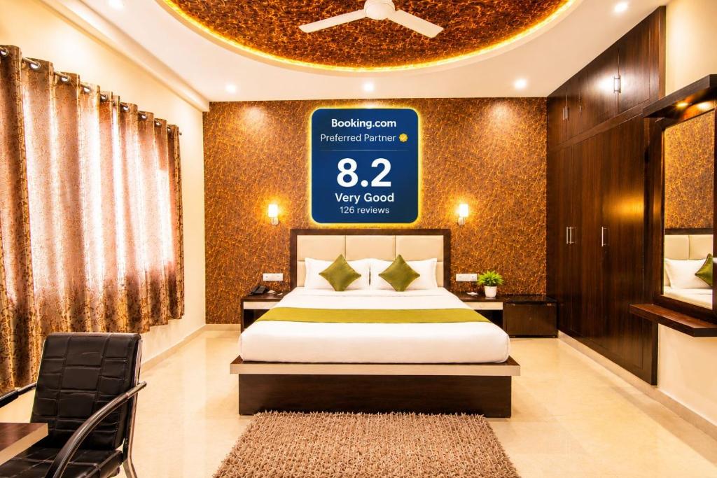 a bedroom with a bed and a large sign on the wall at Hotel Embassy Star Taaj Agra - Budget Ac Rooms Near Taj in Agra