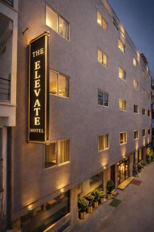 a hotel with a sign on the side of it at The Elevate Hotel Near Terminal 3 Delhi Airport With- Free Airport Pickup in New Delhi