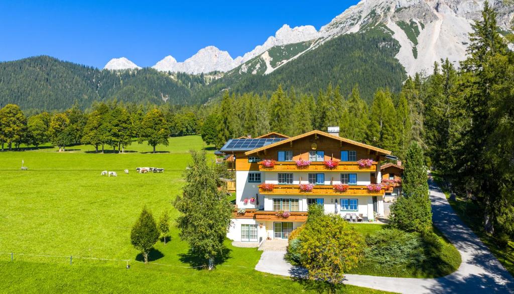an aerial view of a house in the mountains at Alpenperle in Ramsau am Dachstein