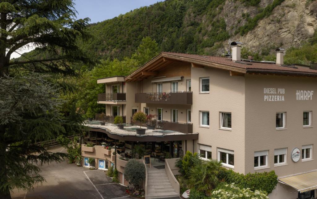 an aerial view of a hotel in the mountains at Hotel Harpf in Bressanone
