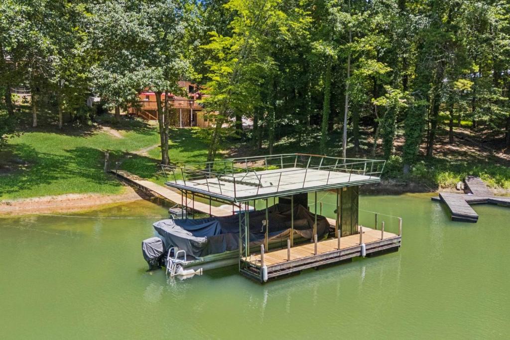 a boat parked in the middle of a body of water at Sues Lake House in Buford