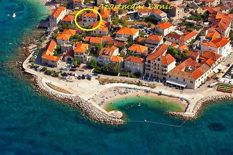 an aerial view of a resort near the water at Apartmani Banić Apartman Studio 3 in Postira