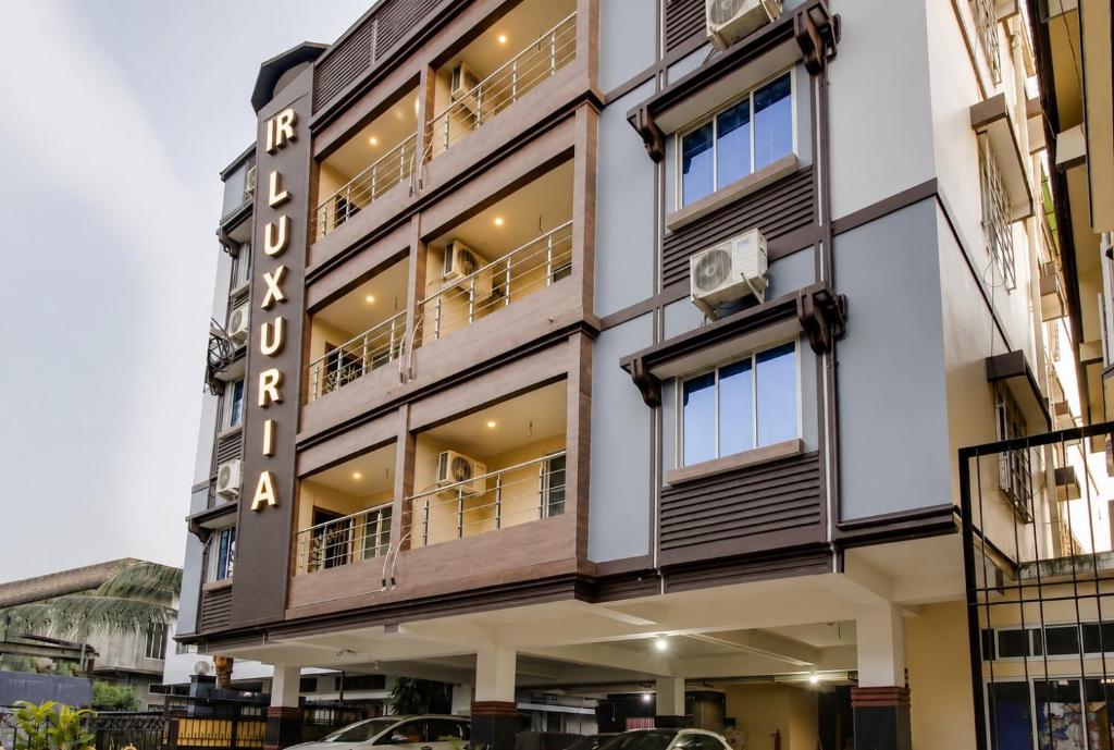 a building with balconies on the side of it at IR Luxuria Hotel, Guwahati in Guwahati
