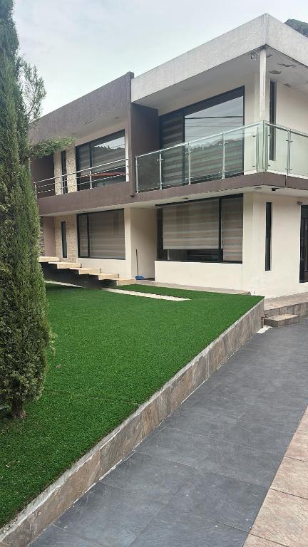 a large house with a lawn in front of it at Kasa Akiro in Juivi