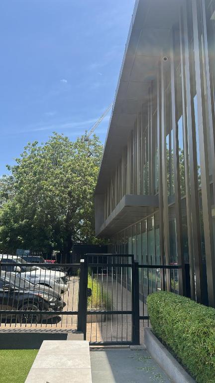 a building with a fence in front of it at Luxury Studio Condo in Accra