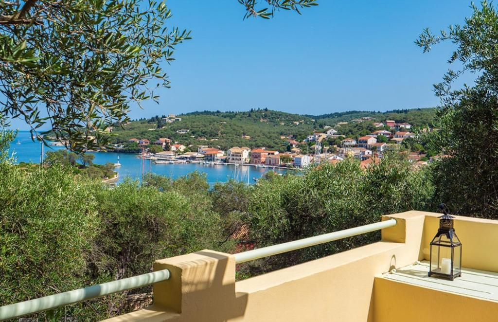 a view of a river from a balcony of a house at Bay View Hotel in (( Klonátika ))