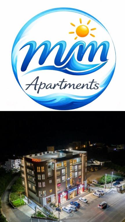 a sign for a nissan apartment building with a hotel at Mir i More in Dobra Voda