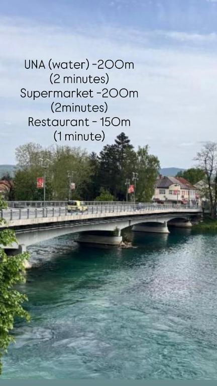 a bridge over a river with words on it at Villa Dani in Bihać