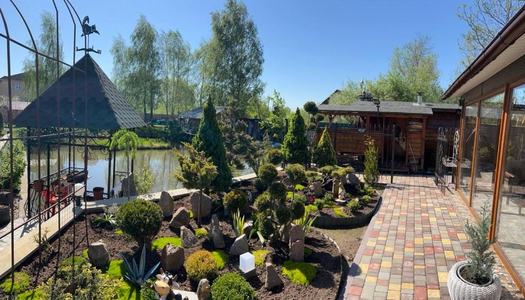 a garden with many plants in a yard at Lake Relax in Chernihiv
