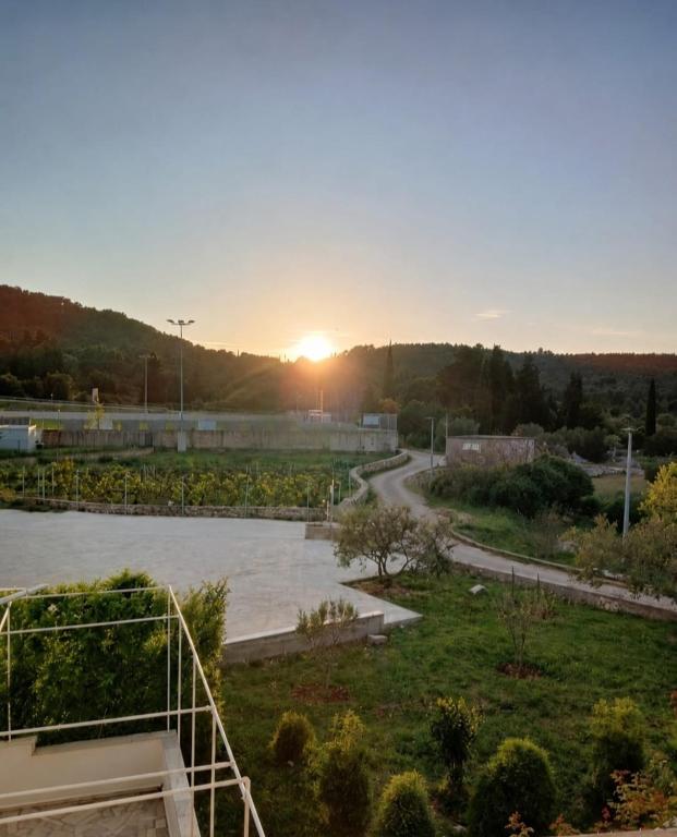 a view of a sunset from a building with a road at Apartment "MANNA in Korčula