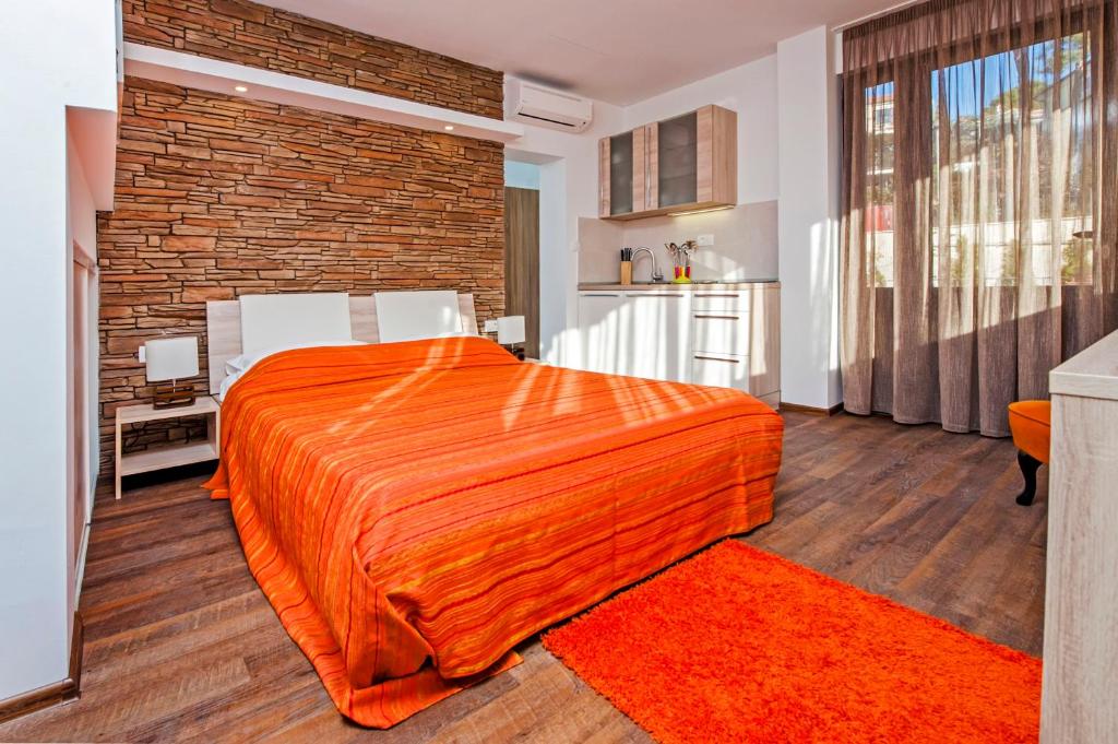 Postel nebo postele na pokoji v ubytování Apartments Figarola