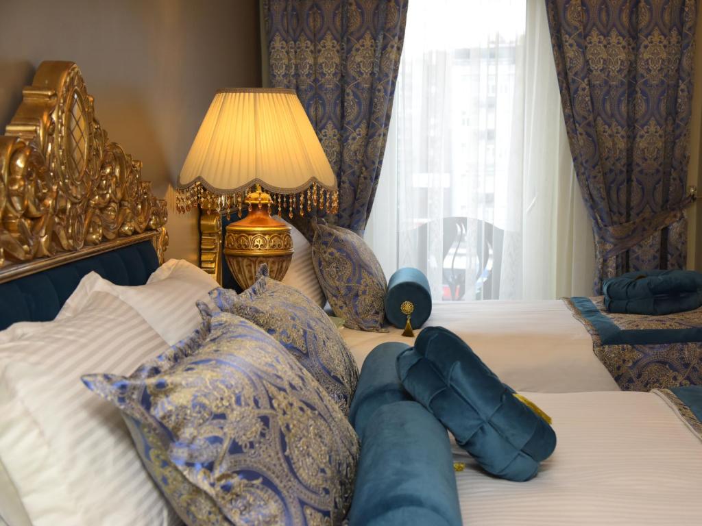 Postel nebo postele na pokoji v ubytování İstasyon Hotel