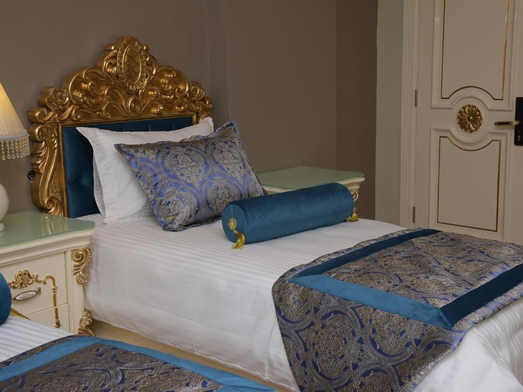 Postel nebo postele na pokoji v ubytování İstasyon Hotel
