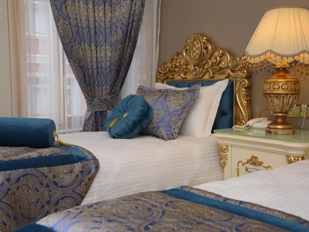 Postel nebo postele na pokoji v ubytování İstasyon Hotel