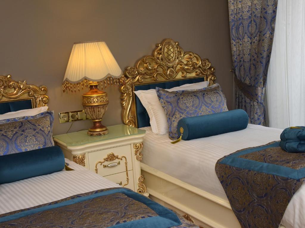 Postel nebo postele na pokoji v ubytování İstasyon Hotel