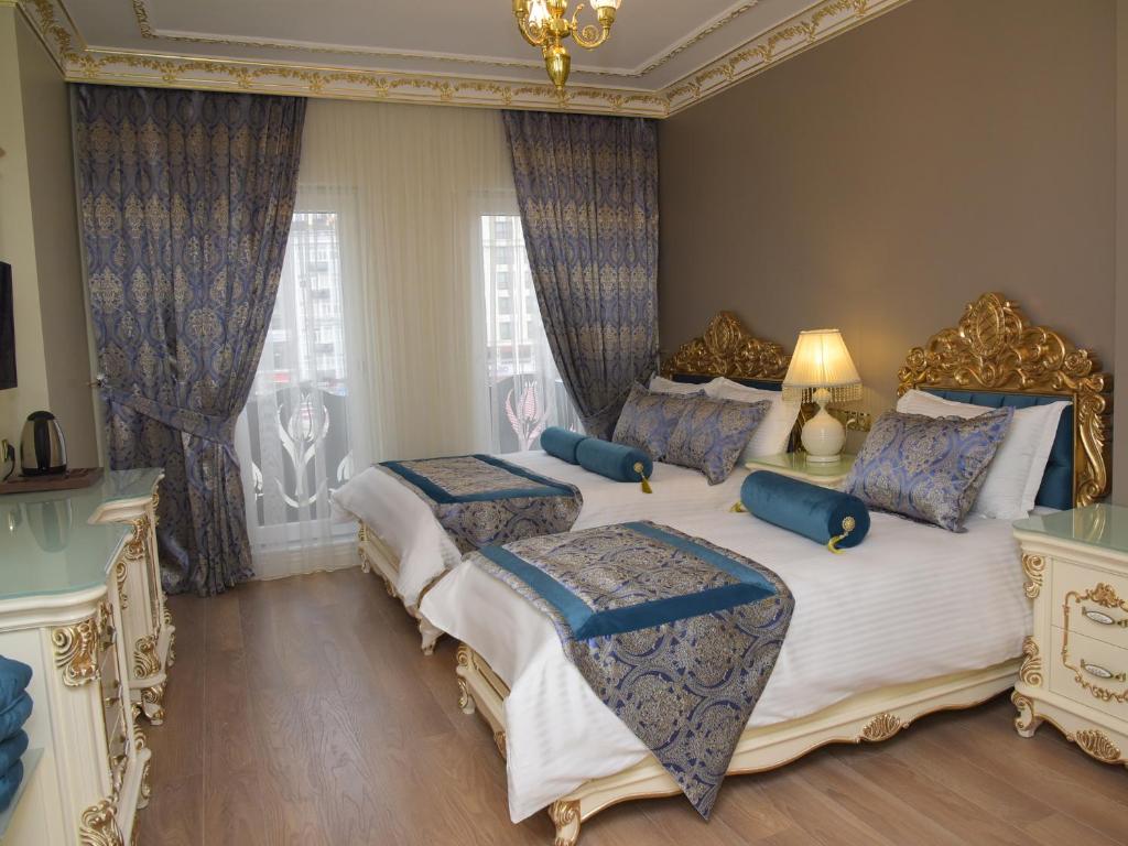 Postel nebo postele na pokoji v ubytování İstasyon Hotel