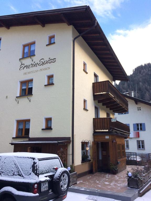 a car parked in front of a building at Haus Erwin Spiss in Sankt Anton am Arlberg