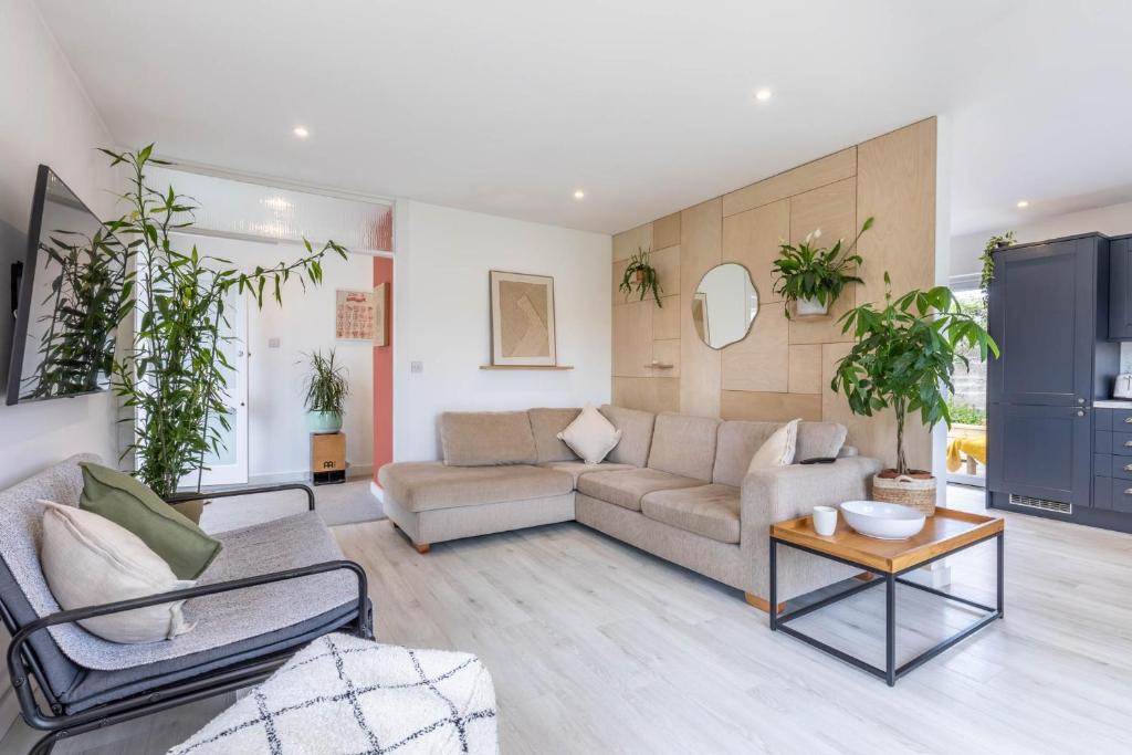 a living room with a couch and a table at 11 Dune View in Braunton