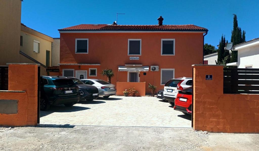 a man standing on the roof of a building at Villa Abelia in Medulin