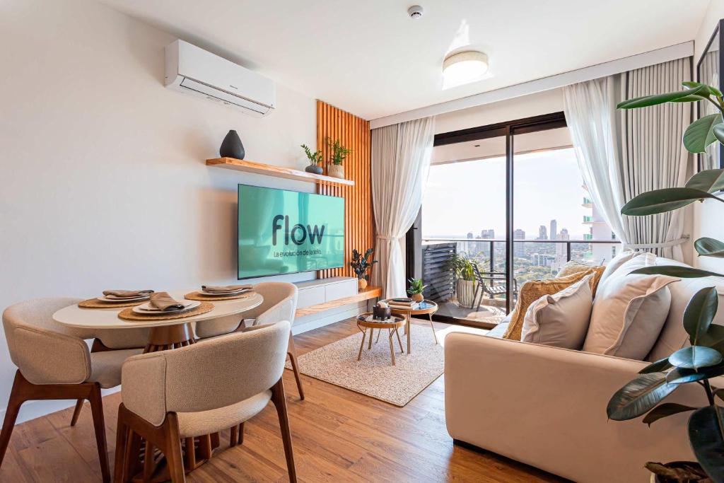 a living room with a couch and a table at Stylish Luxury Apartment - Fully Equipped in Asunción