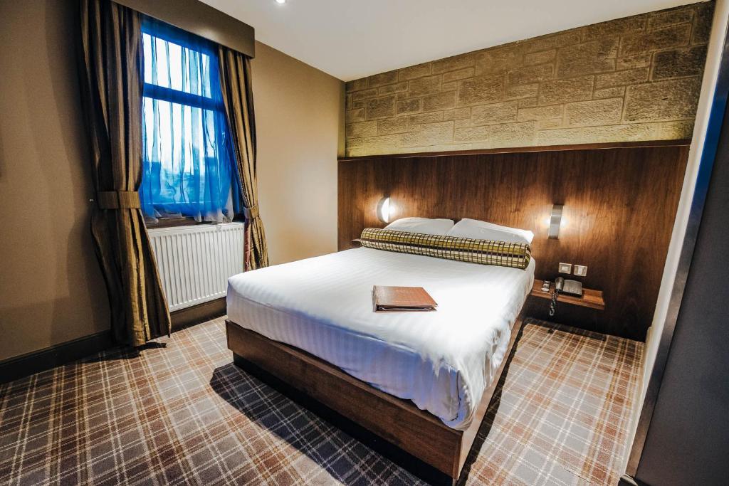 Postel nebo postele na pokoji v ubytování Lynnhurst Hotel
