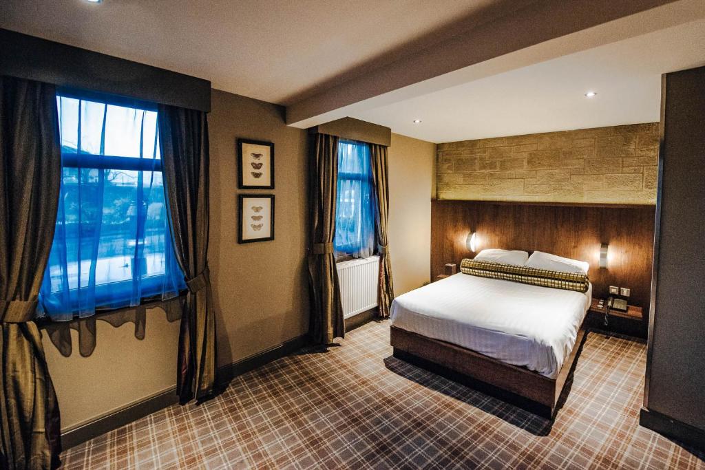 Postel nebo postele na pokoji v ubytování Lynnhurst Hotel