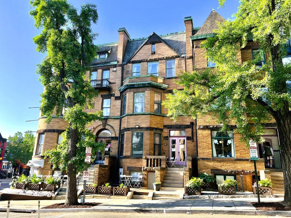 a large brick building with trees in front of it at HighRoad Washington DC in Washington, D.C.