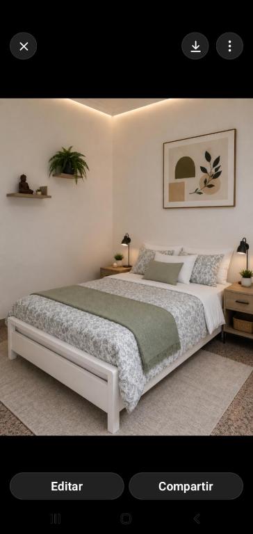 a bedroom with a large bed in a room at Hogar Leticia in Seville