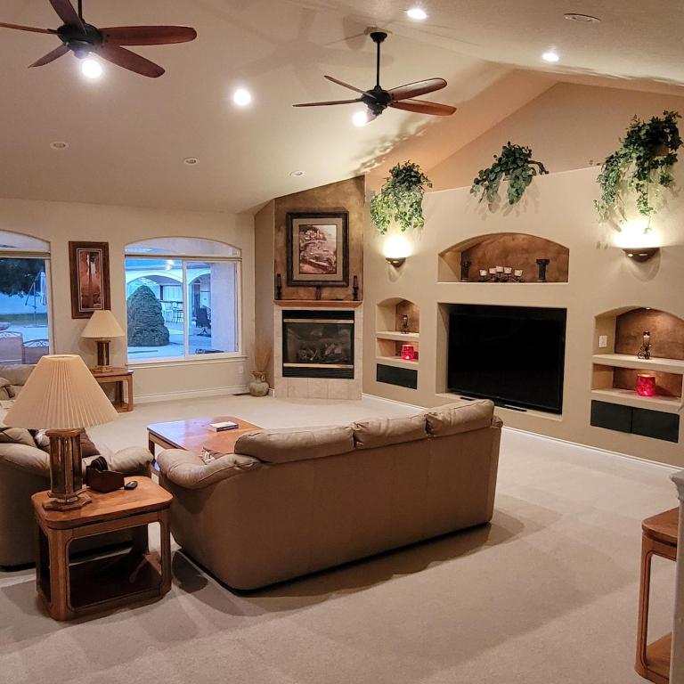 a living room with a couch and a tv at Monument Resort in Grand Junction