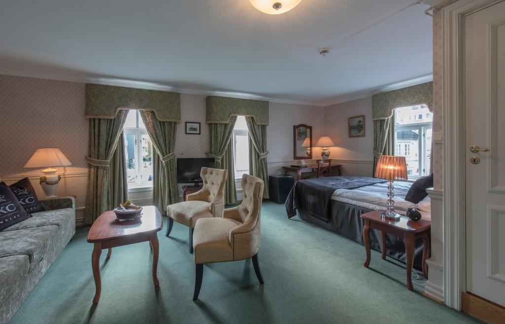 Postel nebo postele na pokoji v ubytování Hotel Kong Carl - Unike Hoteller