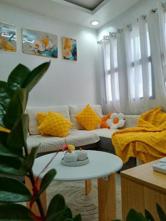 a living room with a couch and a table at Y&S Residence in Olongapo
