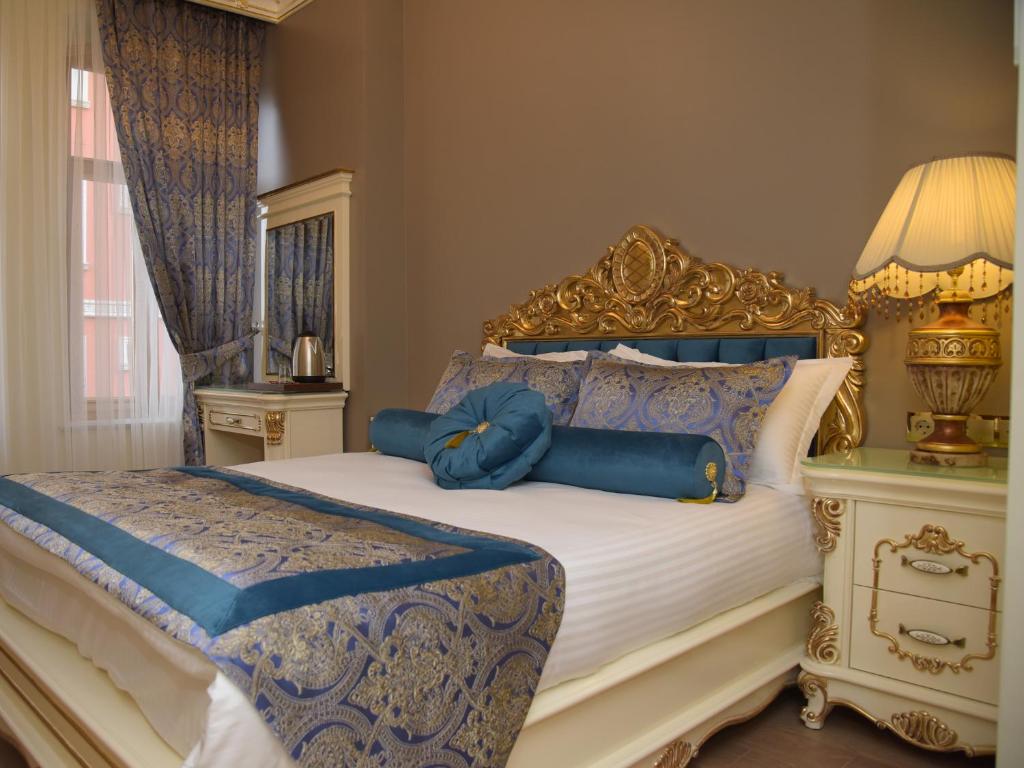 Postel nebo postele na pokoji v ubytování İstasyon Hotel