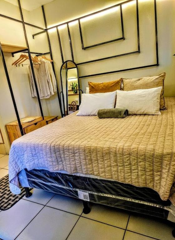 a bedroom with a large bed in a room at Modern Loft #1 in Puerto Barrios