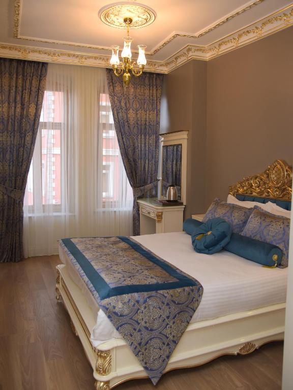 Postel nebo postele na pokoji v ubytování İstasyon Hotel