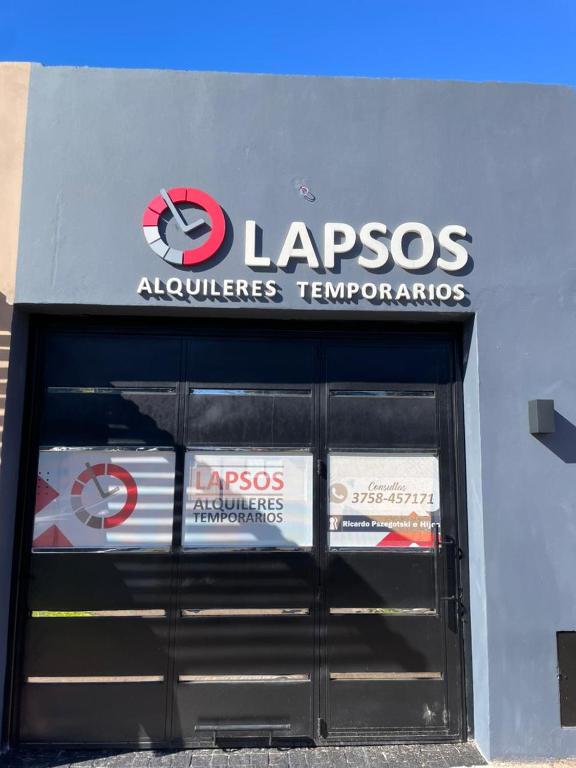 a sign on the side of a car dealership at Apartment 2 in Apóstoles